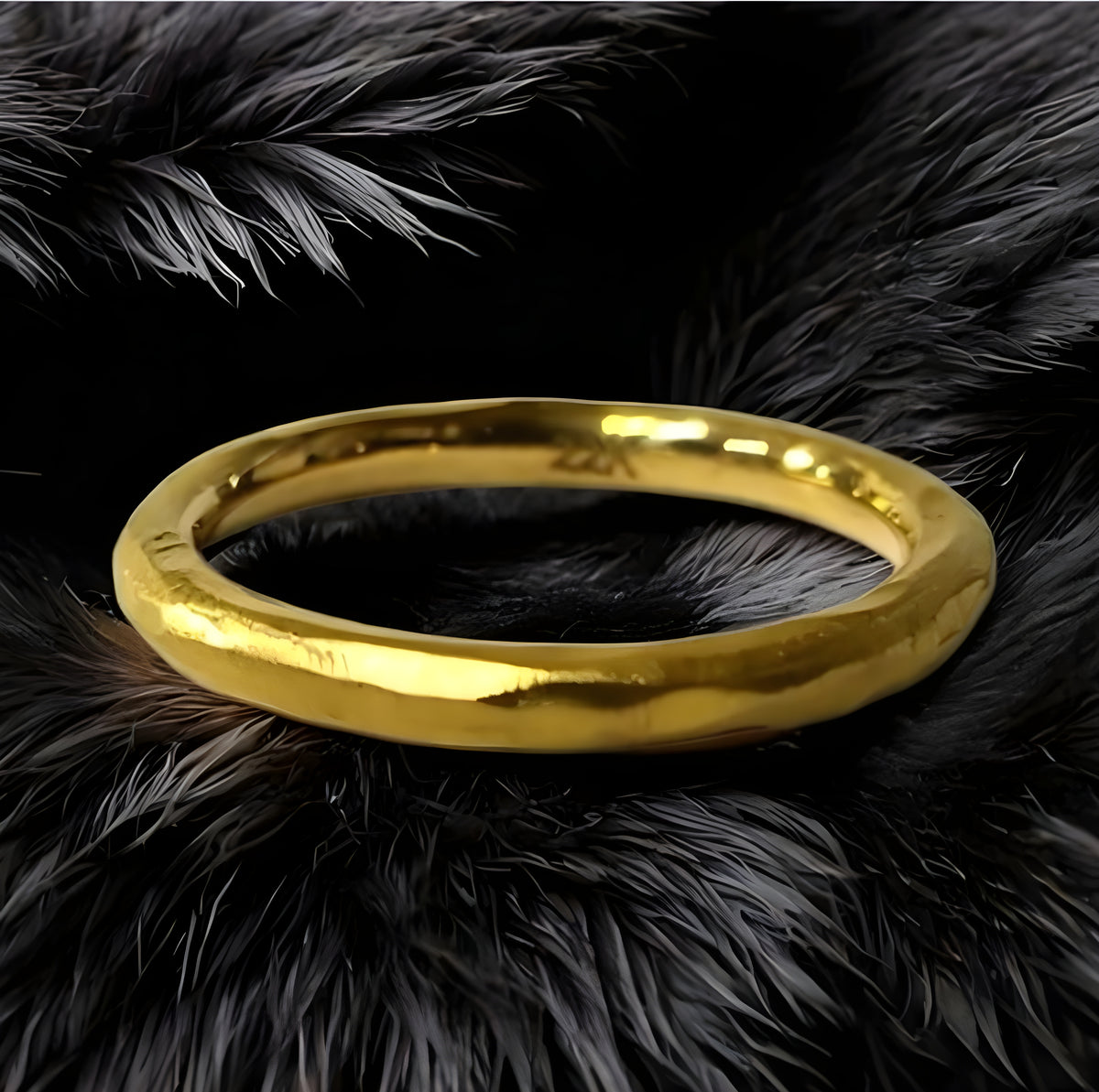 Gold ring on a black furry surface
