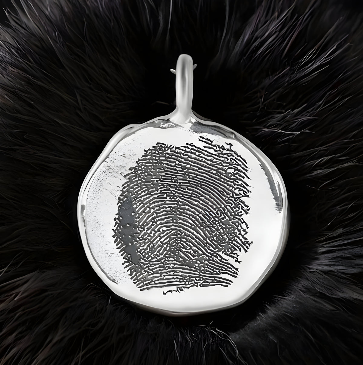 Silver fingerprint pendant on a black fur background
