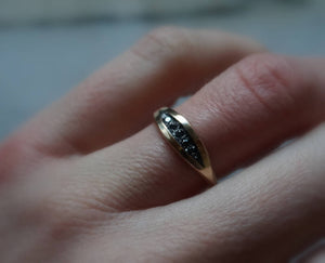 Palma black diamond ring in 14k yellow gold with rough textured band and black rhodium plating