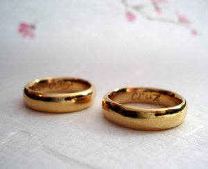 22k solid Gold classic wedding band set  with custom engravings inside.
